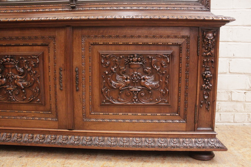 Exceptional renaissance showcase in walnut with iron doors