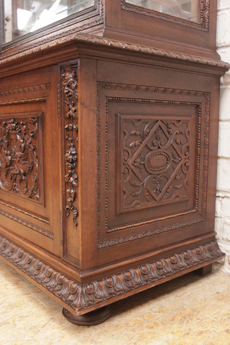 Exceptional renaissance showcase in walnut with iron doors