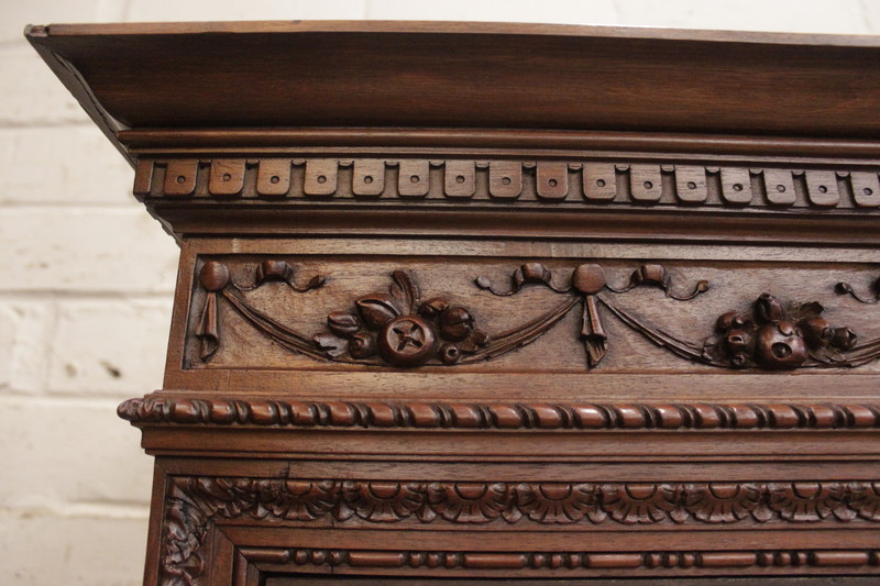 Exceptional renaissance showcase in walnut with iron doors