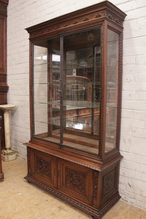 Exceptional renaissance showcase in walnut with iron doors