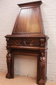 Figural renaissance fire mantle in walnut