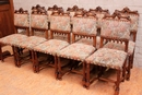 Gothic style 2 arm chairs and 10 chairs in Walnut, France 19th century