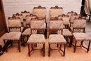 Gothic style 2 arm chairs and 10 chairs in Walnut, France 19th century