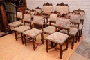 Gothic style 2 arm chairs and 10 chairs in Walnut, France 19th century