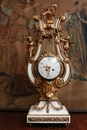 Louis XVI style Mantle clock set in Bronze and marble, France 19th century