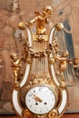 Louis XVI style Mantle clock set in Bronze and marble, France 19th century