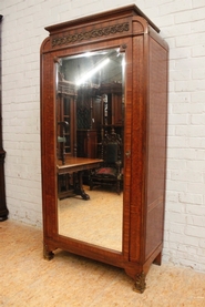 Mahogany and bronze single door armoire