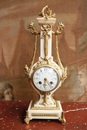 Louis XVI style Clock in mahogany & gilt bronze, France 19th century