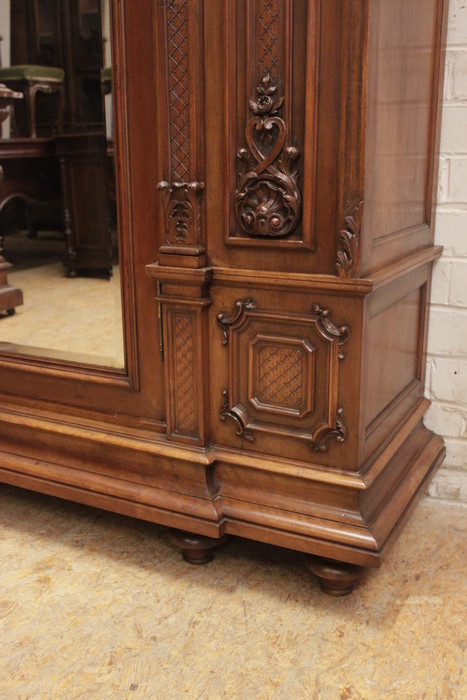 Monumental single door regency style armoire in walnut