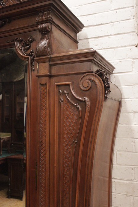 Monumental single door regency style armoire in walnut