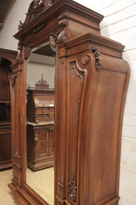Monumental single door regency style armoire in walnut