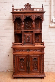 Narrow breton figural cabinet