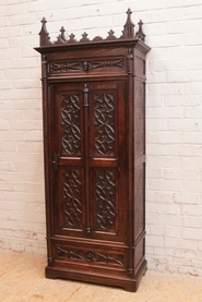 Narrow gothic style armoire in oak