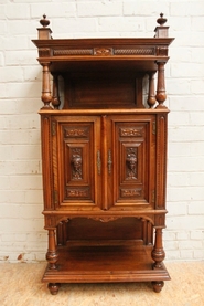 Narrow walnut renaissance cabinet