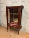 Oval display cabinet with bronze