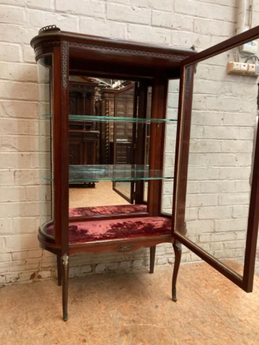 Oval display cabinet with bronze