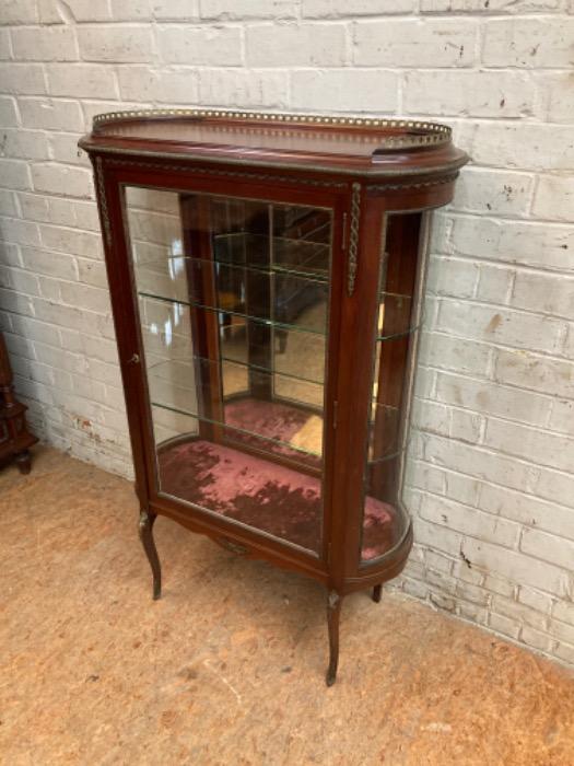 Oval display cabinet with bronze