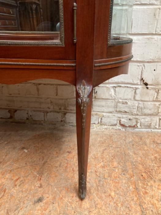 Oval display cabinet with bronze