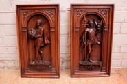 Pair figural wall panels in walnut