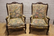 Pair walnut Louis XV bergeres with needlepoint