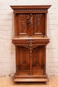 Quality figural renaissance cabinet in walnut