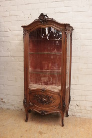 quality Louis XV bombe display cabinet in walnut with gilt accents