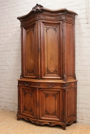 Regency style bombe cabinet in walnut