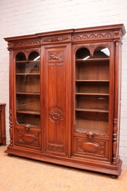 Renaissance style 3 door bookcase in walnut