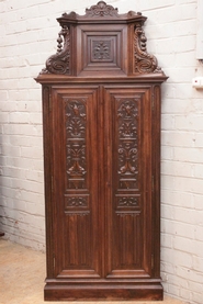 Renaissance style corner cabinet in walnut