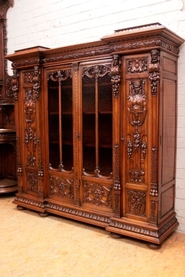 Top quality 4 door renaissance bookcase in walnut signed Lerolle Paris